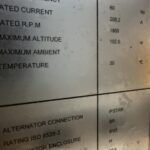 a metal sign with black text